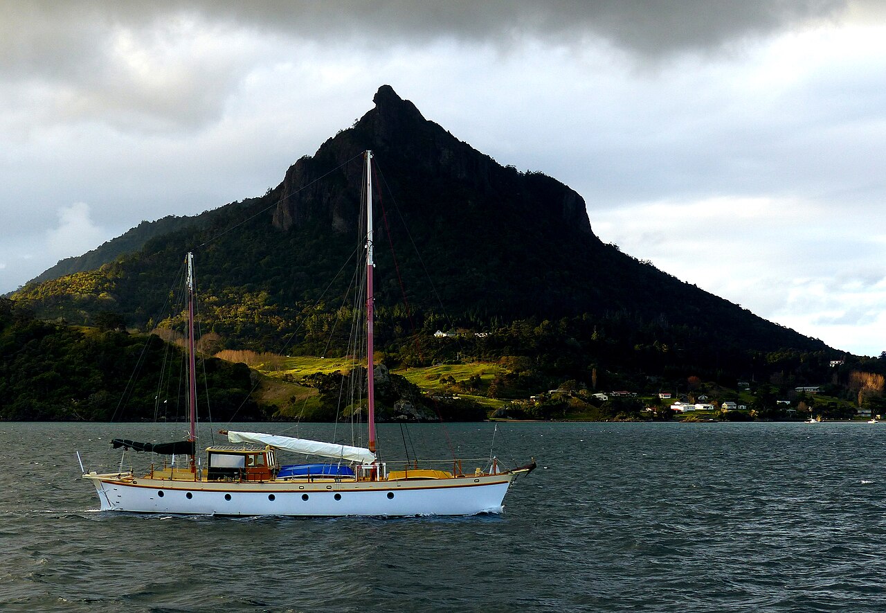 A classic yacht on Whangarei Harbour beneath Mount Manaia