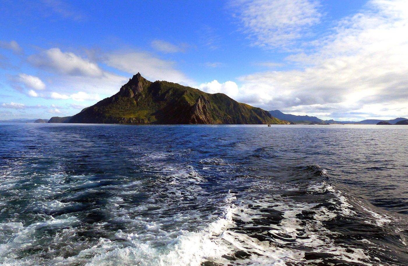 Whangarei Heads seen from the water, with Mount Manaia above the coastline